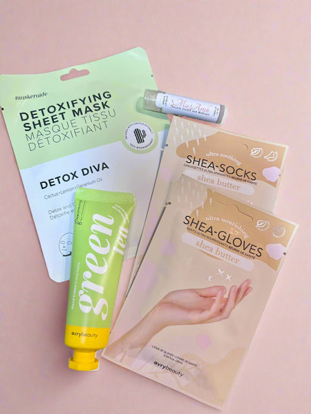 Collection of skincare products including a sheet mask, lip balm, and gloves